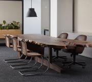 Live edge conference table with walnut slab top and custom cantilever base, under mount technology access 